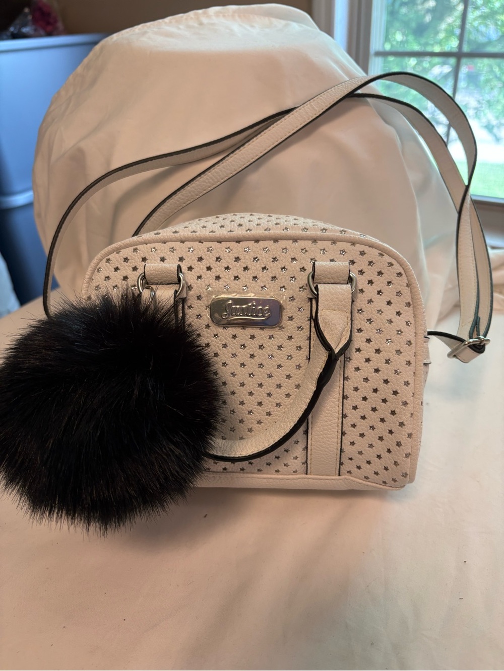 Justice White Crossbody Bag with Black Pom Pom